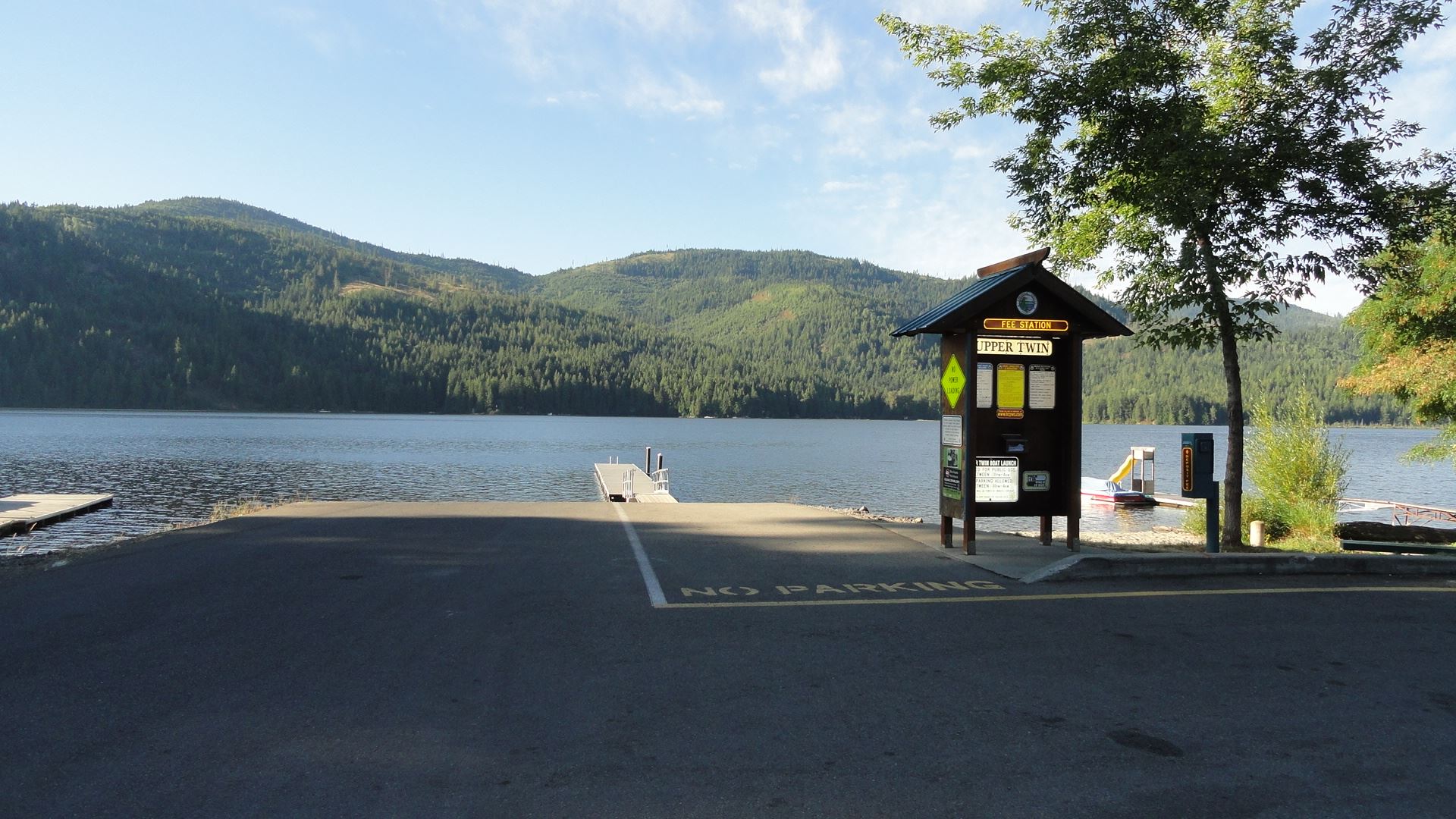 Parking lot leading to boat launch at lake