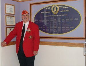 Commissioner Rankin with a Purple Heart Wall