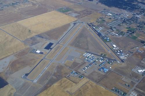 Aerial image of an airport and neighboring city